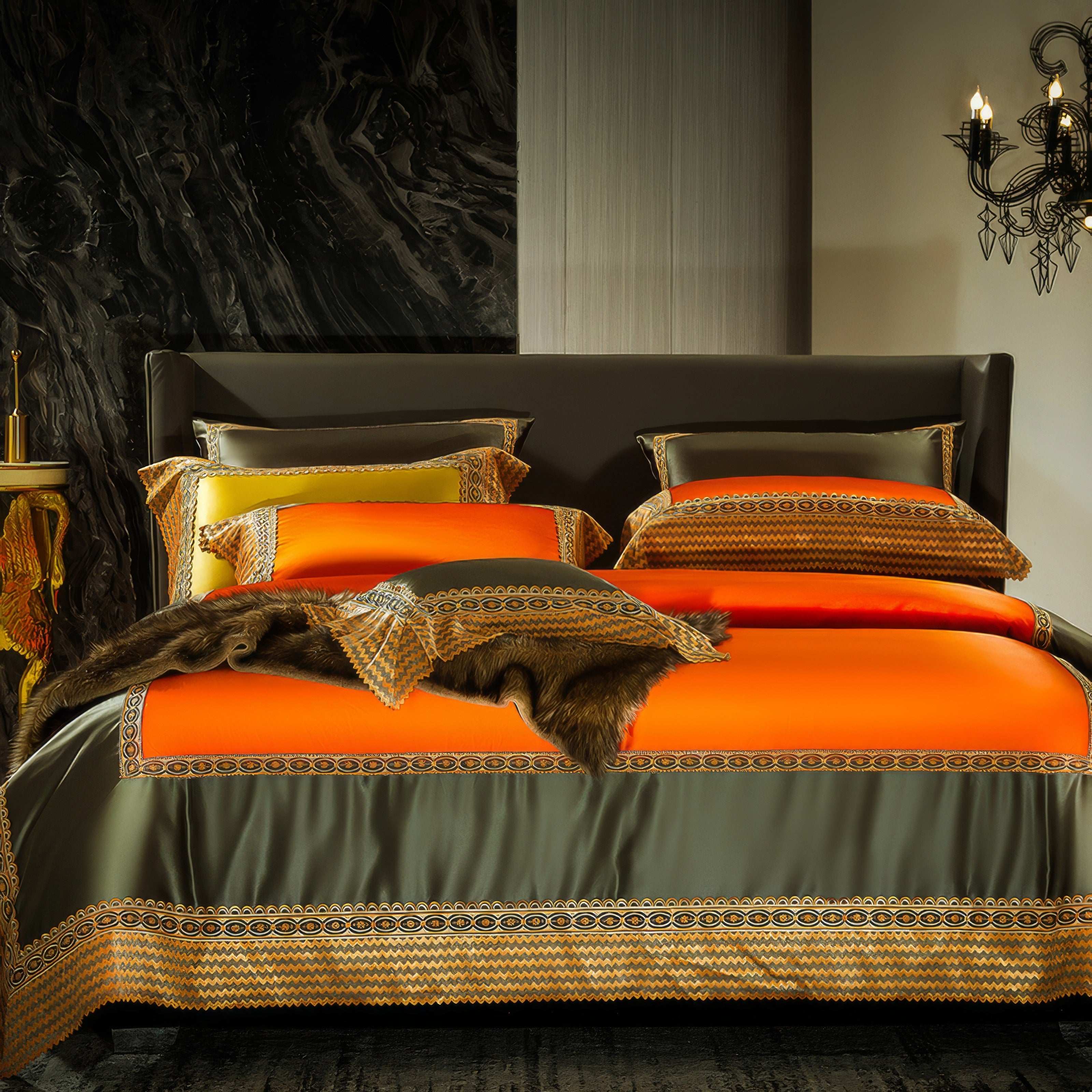 Luxurious bedding set featuring vibrant orange and olive green tones with intricate geometric embroidery, matching pillowcases, and a decorative faux fur accent draped across the bed.