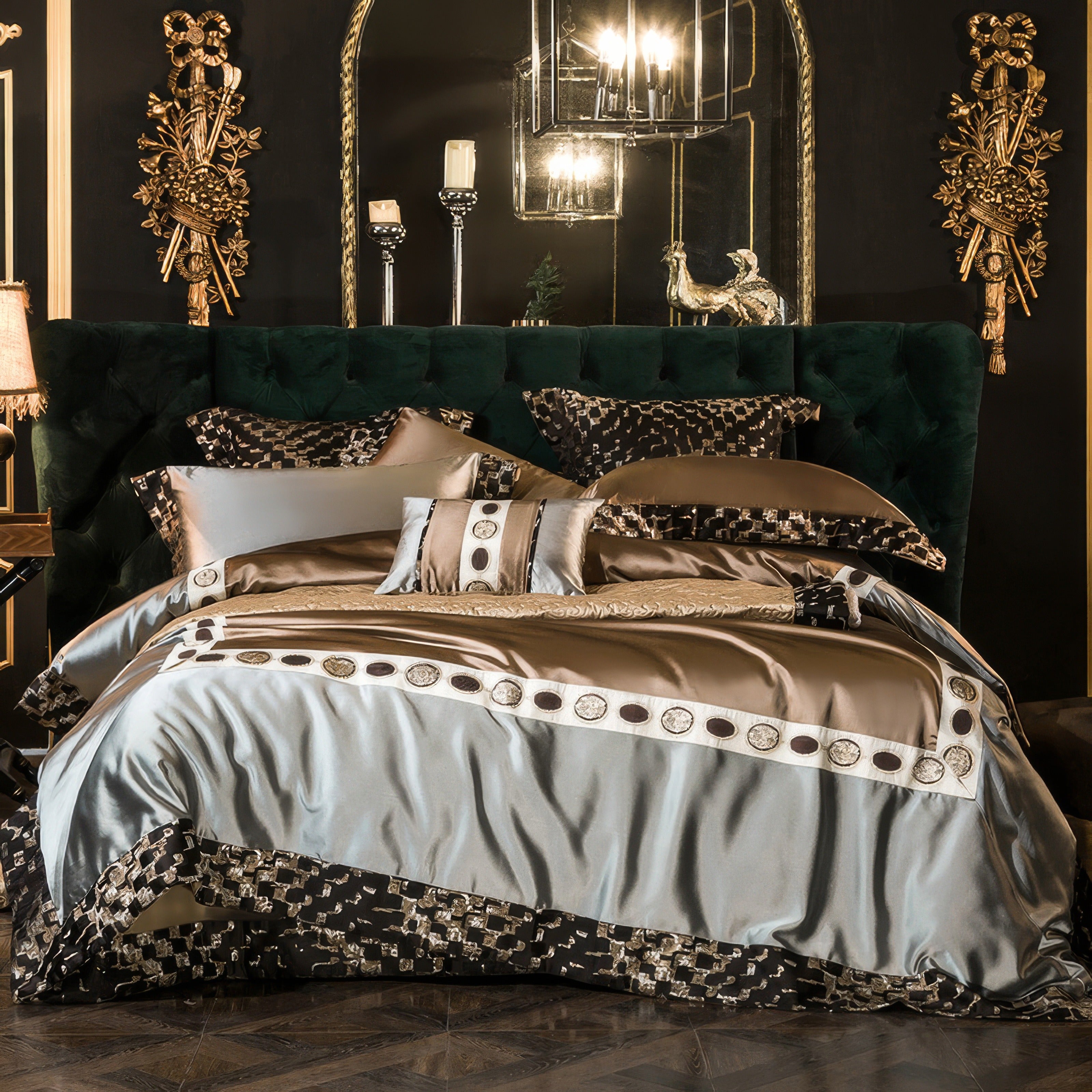 Luxurious bedding set featuring a combination of champagne gold, silver blue, and intricate geometric patterns. The duvet cover and pillowcases showcase a silky sheen, complementing the plush green tufted headboard. The design blends elegance and modern sophistication, highlighted by decorative trim and embroidered details. The black and gold pillows and base skirt contrast beautifully, creating a regal and polished bedroom aesthetic.