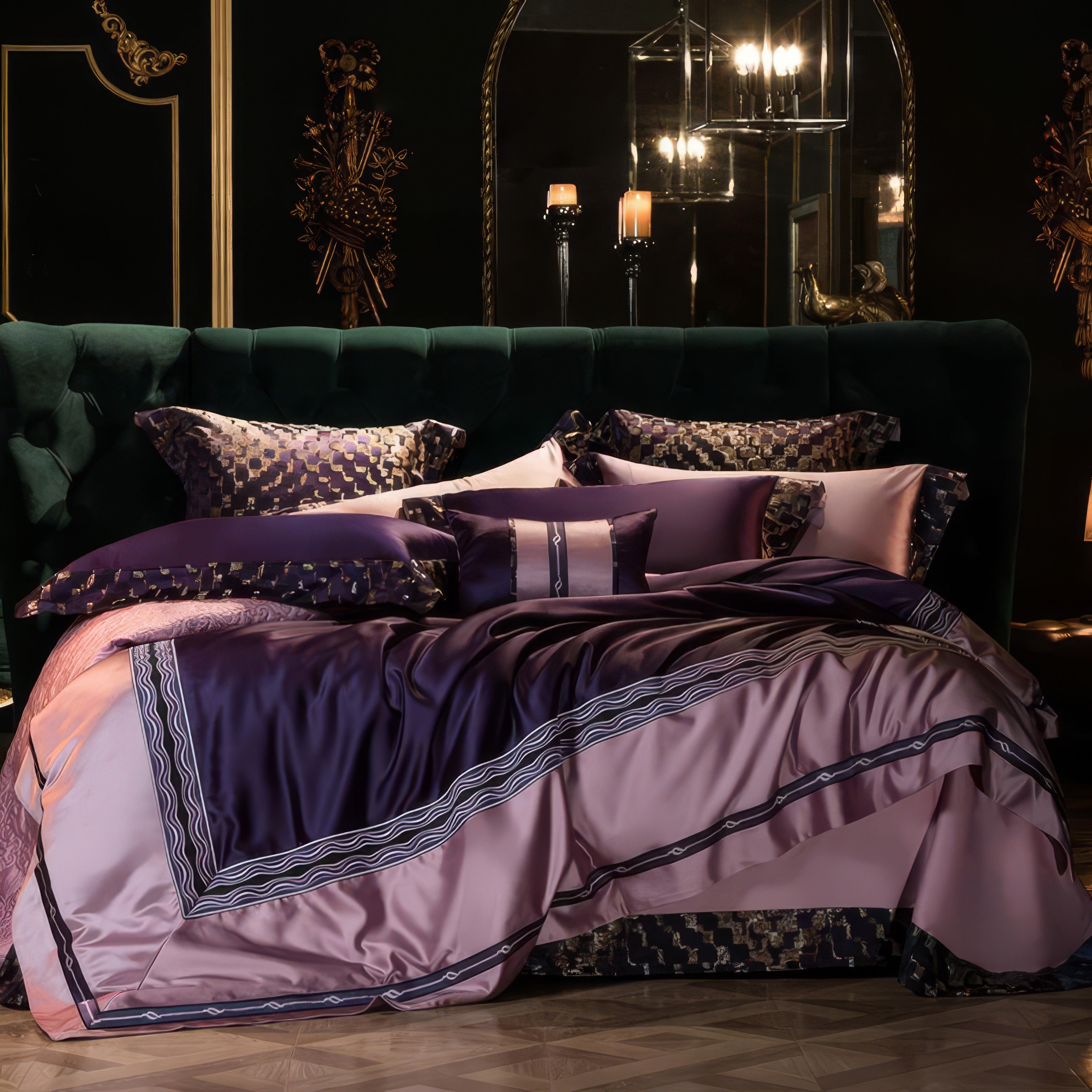 A luxurious bedding set in deep purple and blush pink tones with geometric patterned pillowcases and intricate embroidery, displayed on a tufted emerald green headboard. A large mirror and ornate wall decor enhance the opulent ambiance.