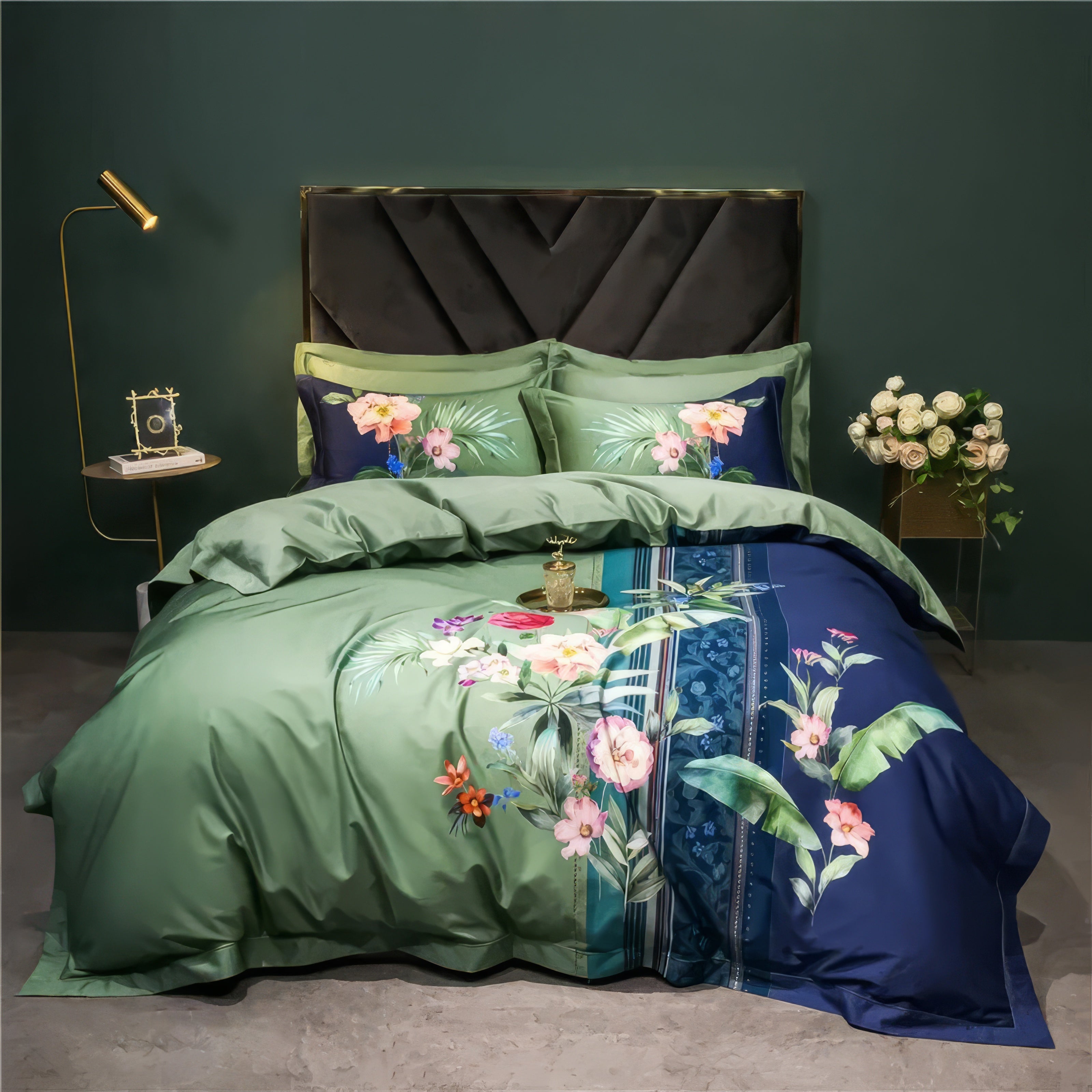 A luxurious bedding set crafted from high-quality Egyptian cotton, featuring a vibrant floral design on a dual-tone green and navy blue duvet cover. The set is paired with matching pillowcases showcasing tropical floral motifs and a solid green backdrop. It includes a black tufted headboard, a gold nightstand adorned with minimalistic decor, and a vase of white roses against a dark green wall.

