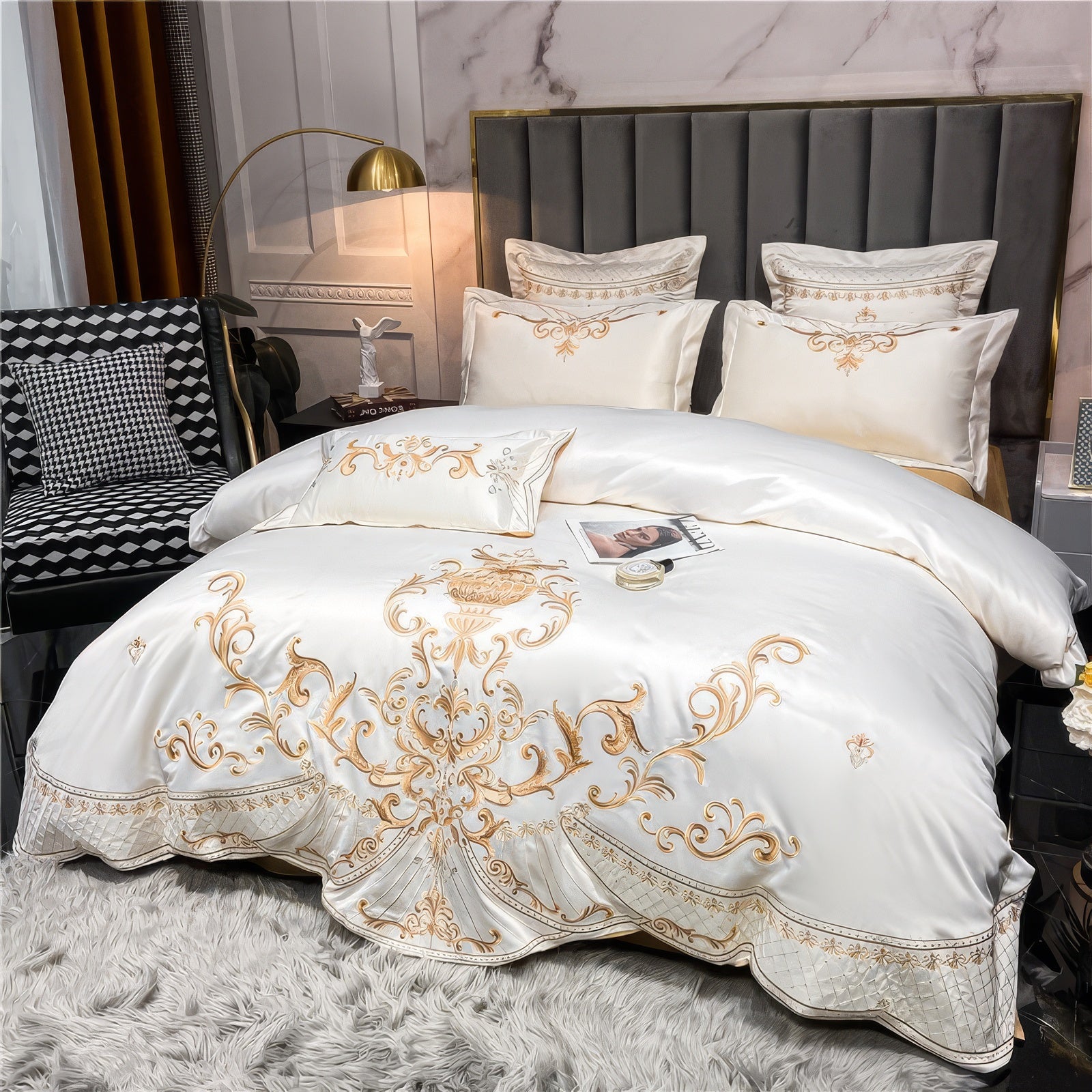 Egyptian cotton bedding in a luxurious ivory-white hue, adorned with intricate gold embroidery showcasing ornate baroque patterns. The duvet set includes coordinating pillowcases with elegant stitching, creating a refined and opulent bedroom aesthetic. The soft Egyptian cotton fabric enhances comfort, offering a smooth and breathable sleeping experience. The setting features a cozy grey rug, stylish accents, and soft lighting that further elevate the bedding's sophisticated appeal.

