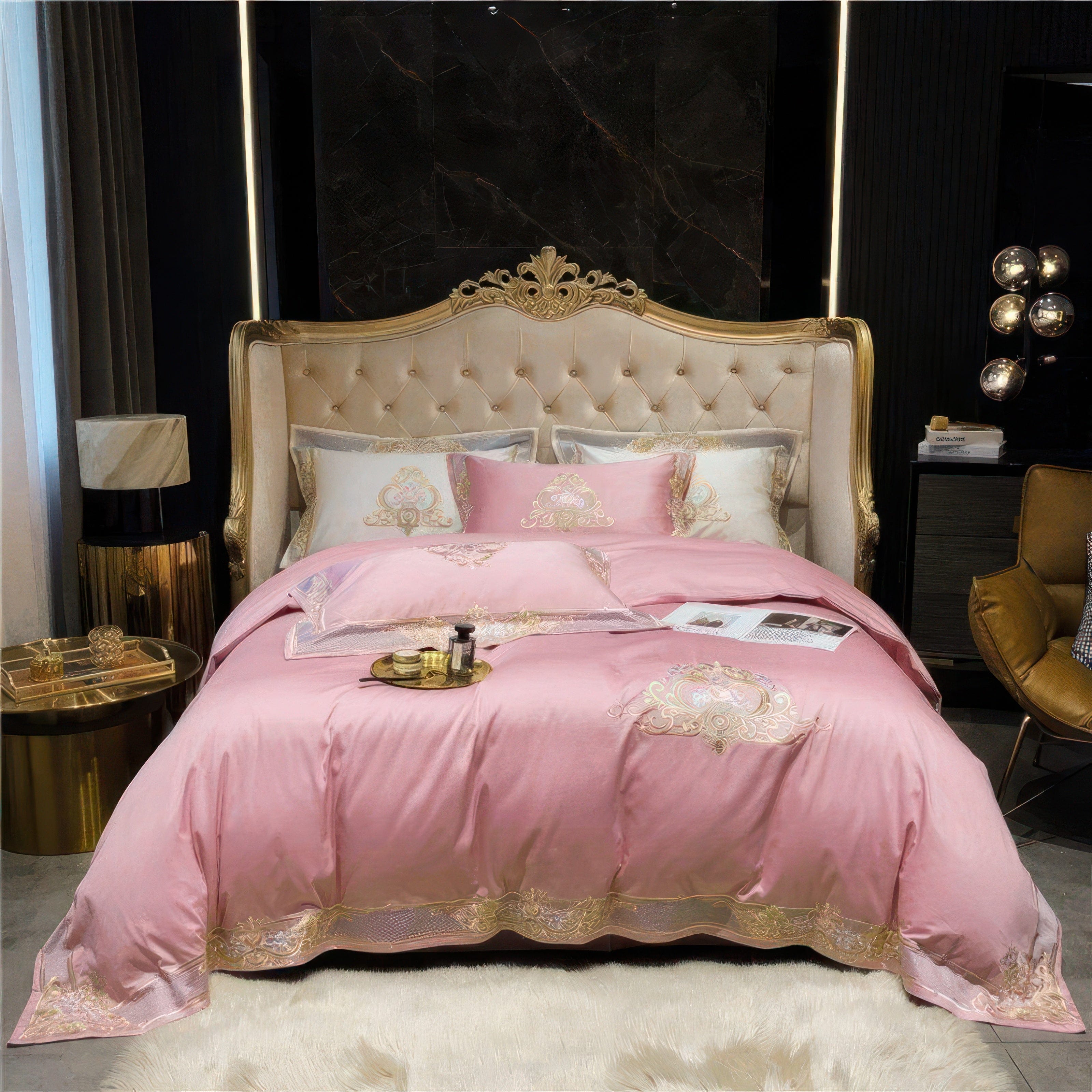 A luxurious bedroom featuring an opulent pink bedding set with intricate gold embroidery and elegant details. The bed is framed by a regal tufted headboard with a gold finish, complemented by sophisticated dark marble wall panels. The room is adorned with golden side tables, ambient lighting, and decorative accents, creating a warm and lavish atmosphere. A soft white rug adds texture and coziness to the overall aesthetic.

