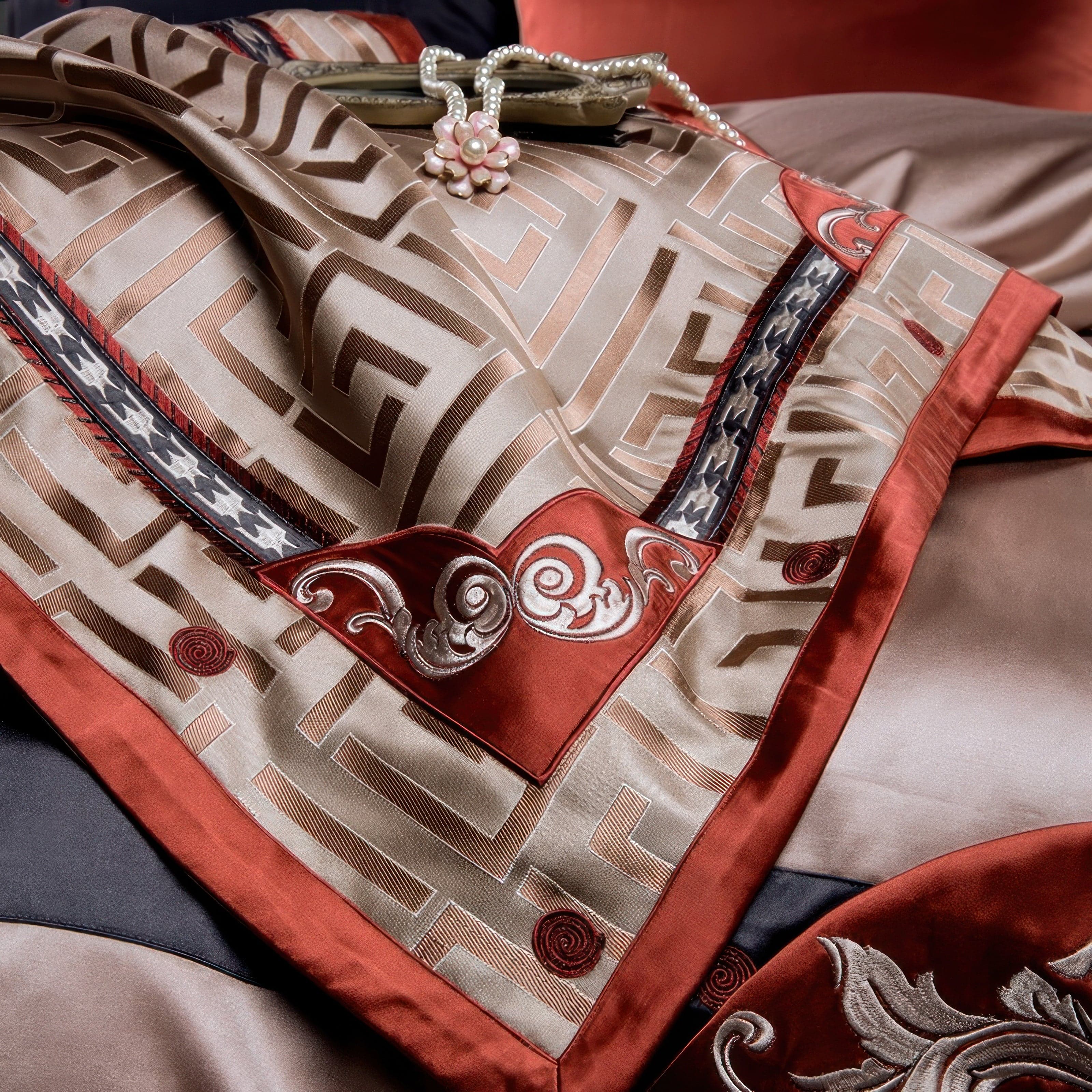 Close-up of a luxurious duvet cover featuring intricate geometric patterns in beige with accents of deep red and black, enhanced by ornate embroidered motifs.