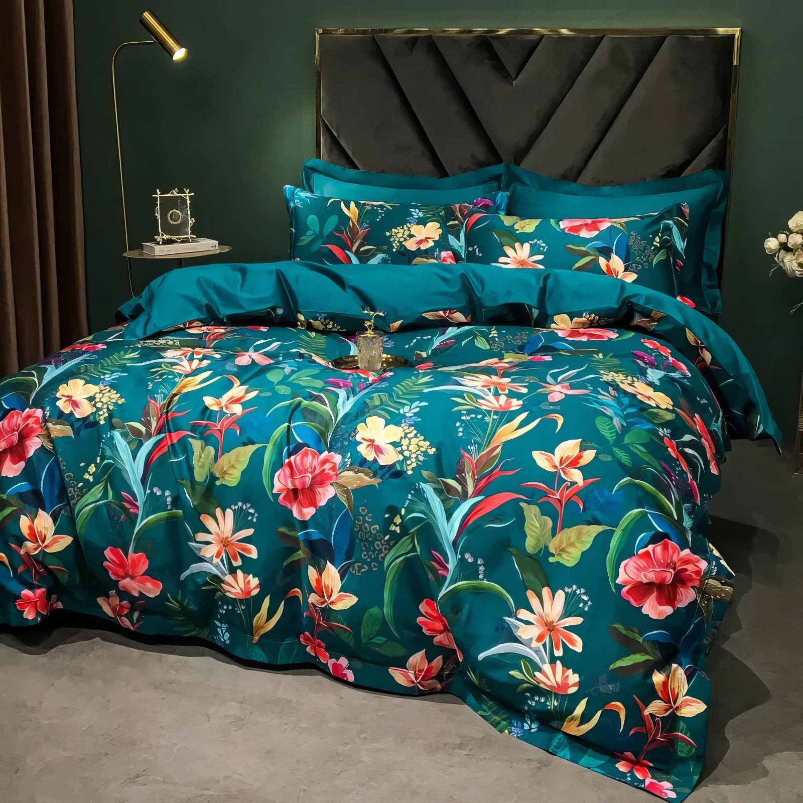 A luxurious Egyptian cotton bedding set with a bold teal base, adorned with vibrant tropical floral patterns in pink, orange, and yellow tones. The set includes matching pillowcases and a solid teal sheet, perfectly arranged in a sophisticated bedroom with a dark velvet headboard, golden accent lamp, and elegant decor elements.

