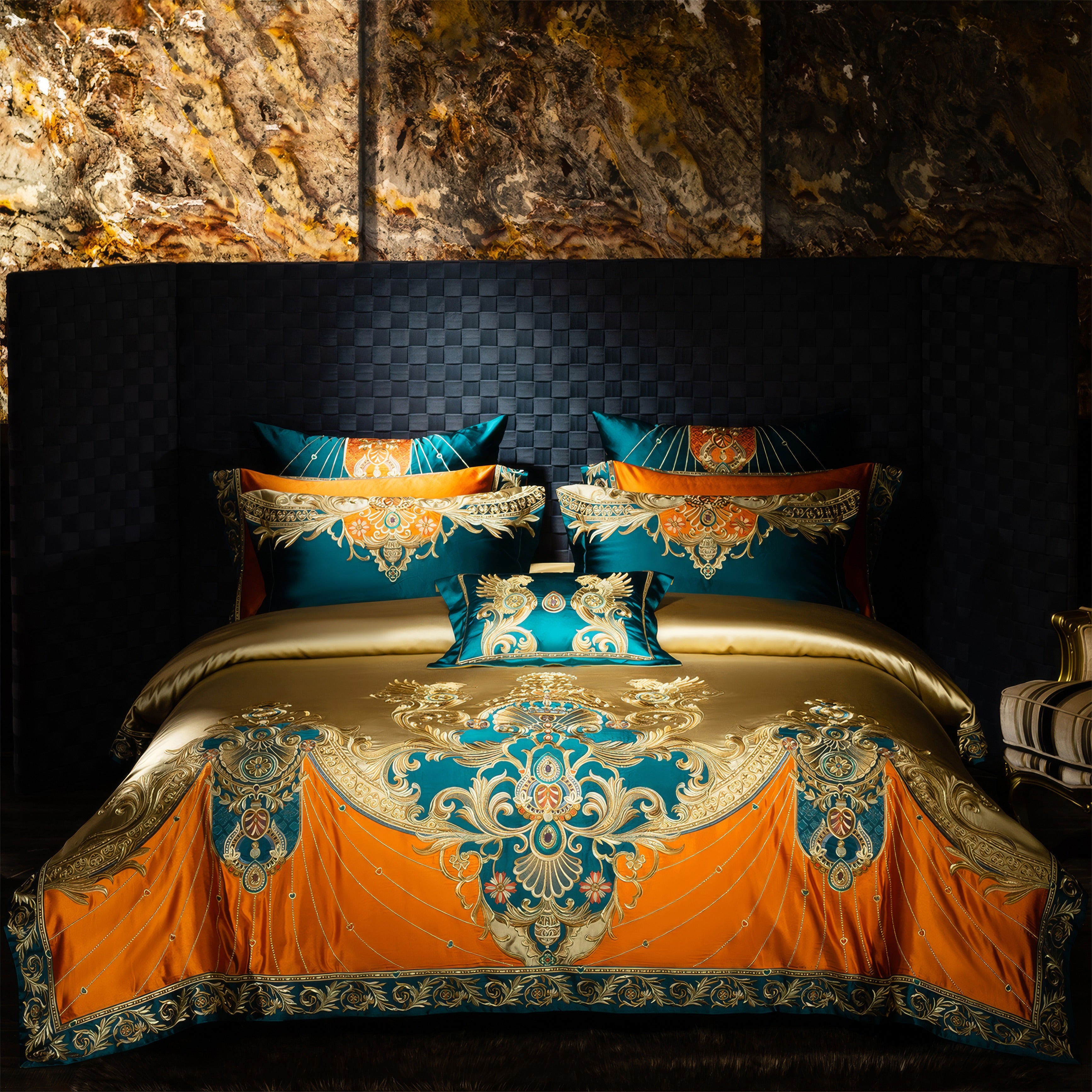 Opulent bedding set featuring a bold teal, orange, and gold color palette with intricate baroque-style embroidery, including matching pillowcases and a decorative throw pillow, styled in a luxurious bedroom with a textured black wall and marble accents.