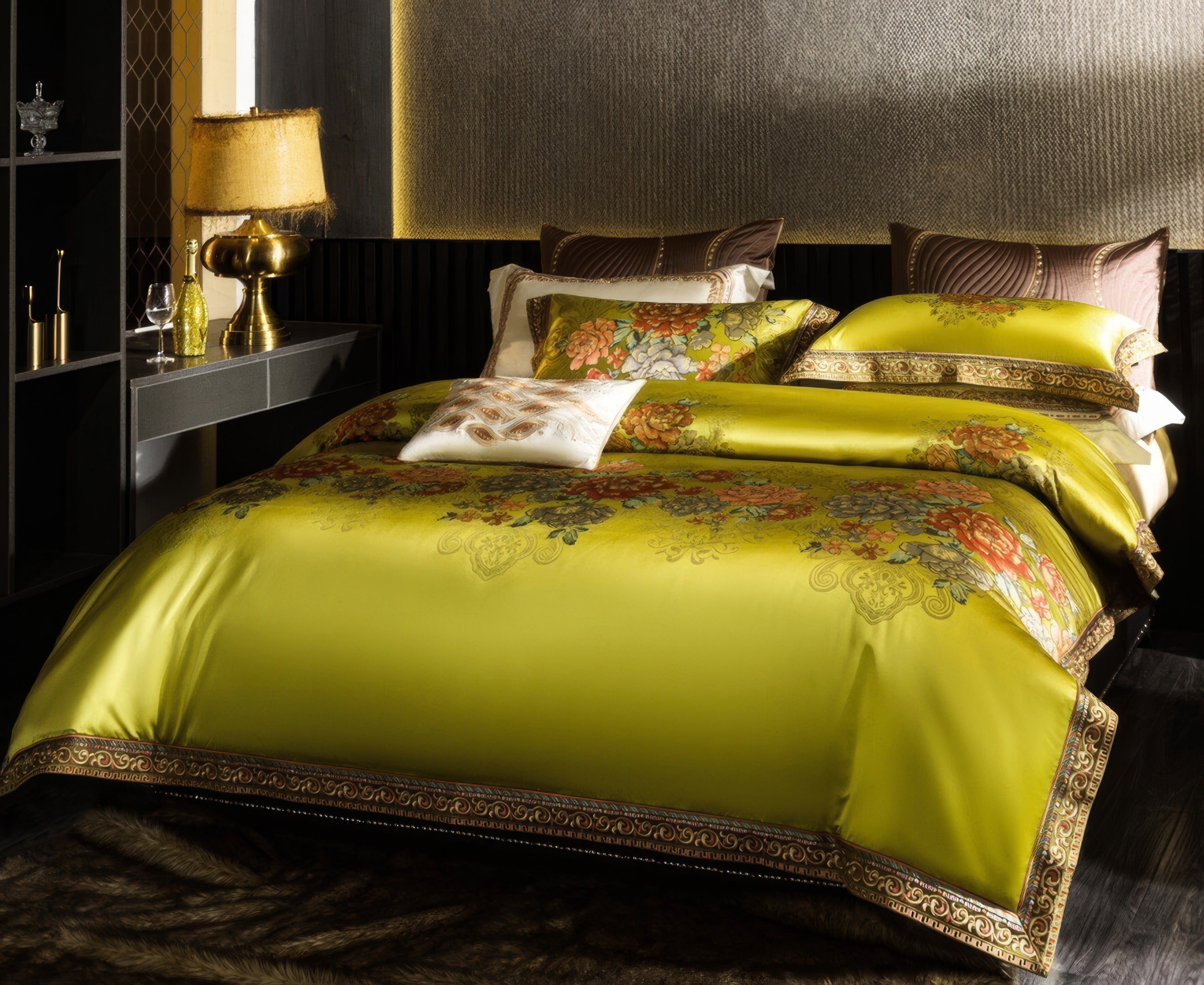 A luxurious lime green bedding set featuring vibrant floral designs in warm orange, pink, and green tones, elegantly bordered with intricate golden embroidery. The bed is styled with coordinated pillows and a contrasting white accent pillow with detailed embroidery. The room's decor includes a golden lamp, decorative items, and a warm, softly lit ambiance with a textured wall backdrop, creating a sophisticated and inviting setting.