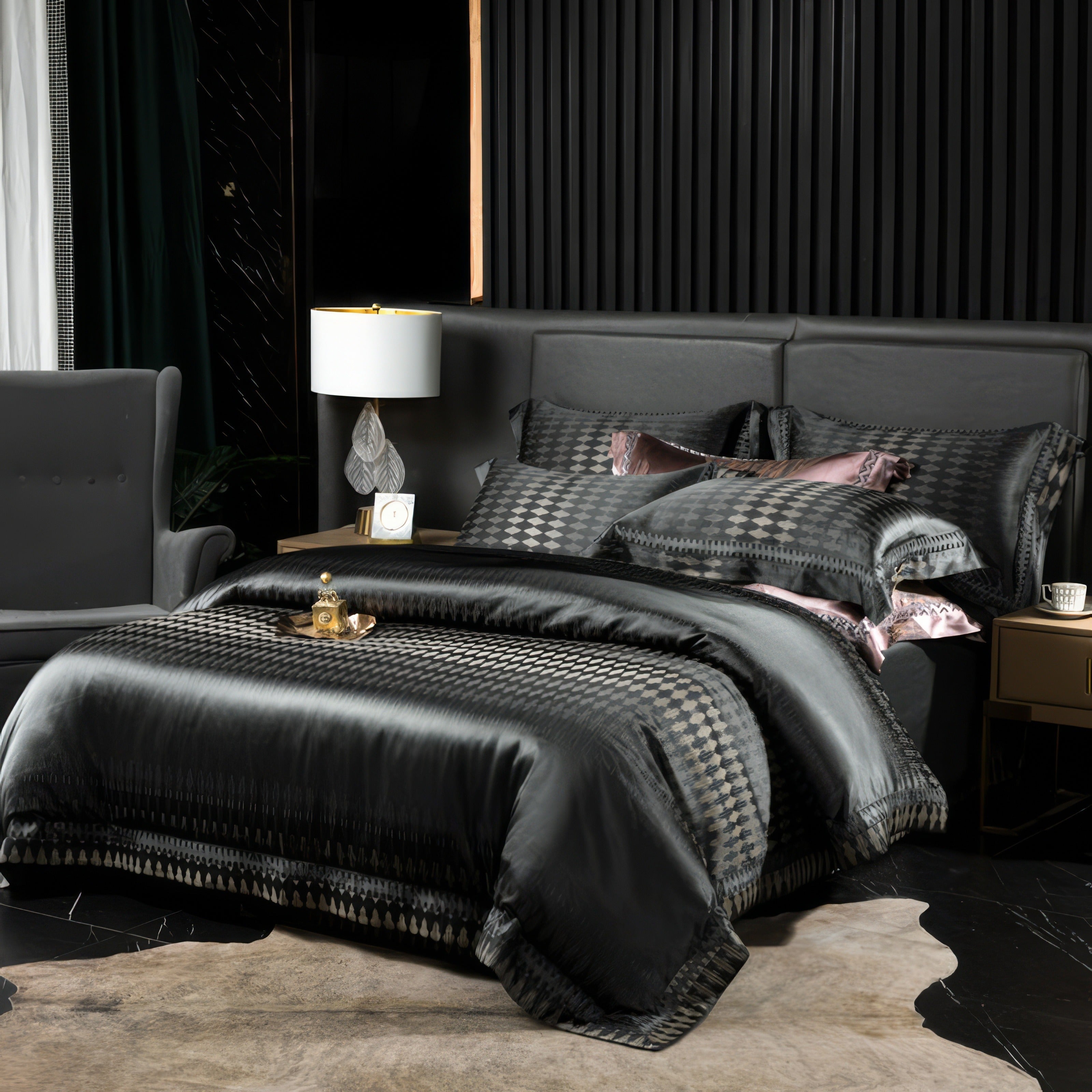 Elegant black bedding set with geometric patterns, paired with pink accent pillows, displayed in a contemporary bedroom with gold nightstands, lamps, and a cozy armchair.

