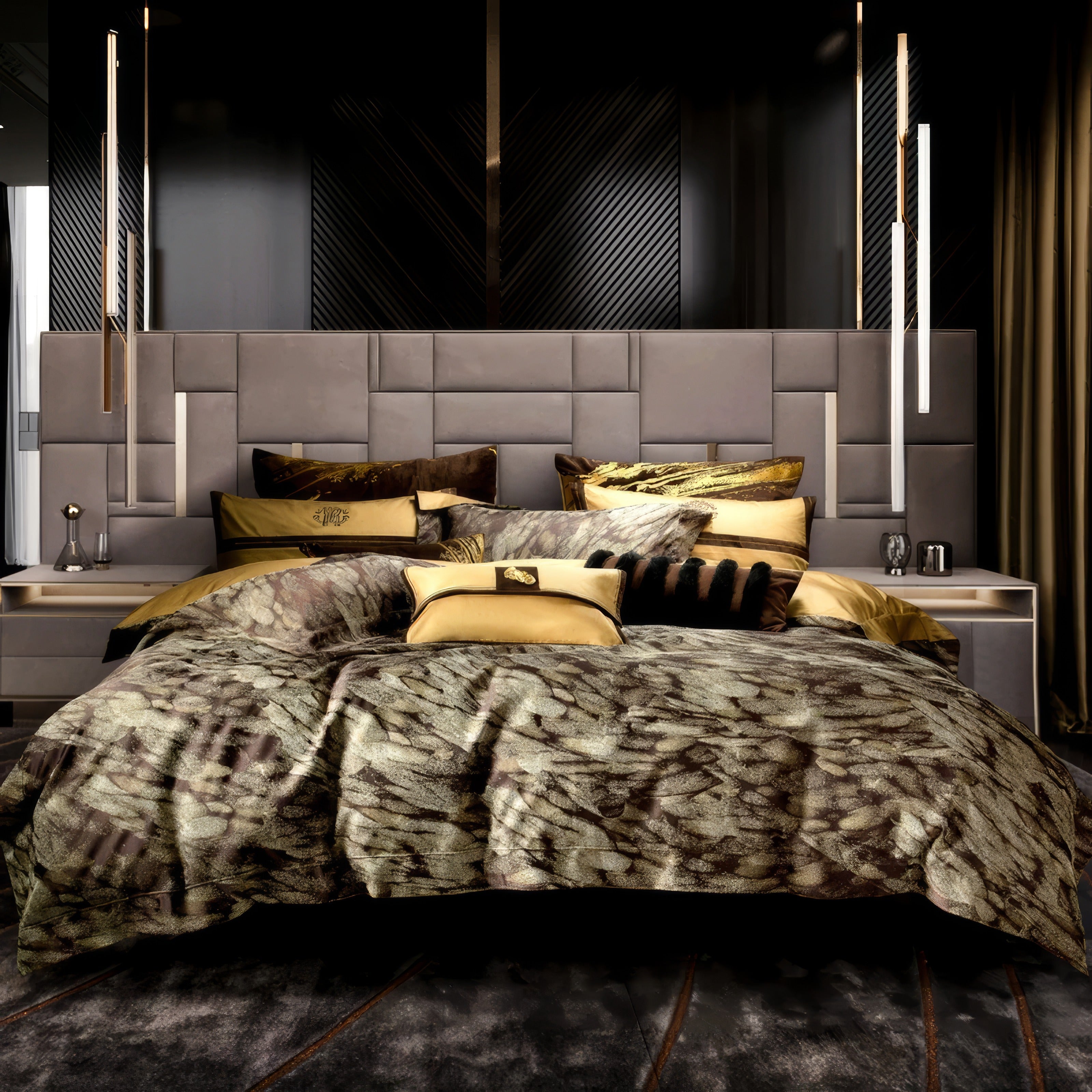 An opulent and modern bedroom featuring a statement upholstered headboard with a geometric panel design in soft grey tones. The bed is adorned with a luxurious bedding set in earthy gold and brown hues, showcasing a textured pattern reminiscent of natural elements. Coordinating decorative pillows in gold and black fur textures add depth and sophistication. The side tables hold minimalist metallic accents, including a sleek table lamp. The room is illuminated by contemporary pendant lights and features rich,