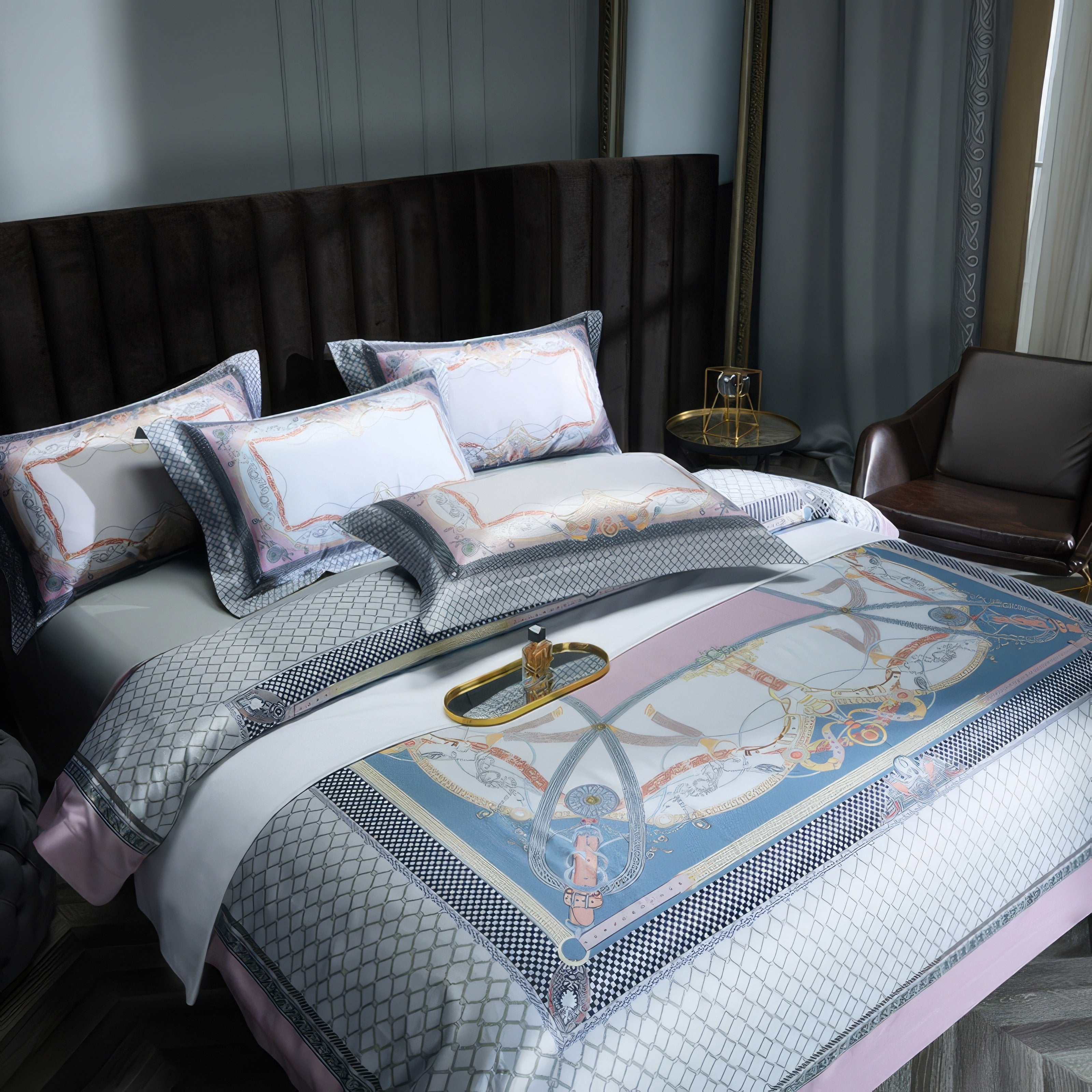 Elegant bedroom featuring a luxurious bedding set with intricate patterns in soft pink, blue, and gray hues. The duvet cover and pillowcases showcase ornate designs accented with geometric borders. The dark, upholstered headboard adds contrast, while a brown leather chair and gold side table complete the sophisticated setting.

