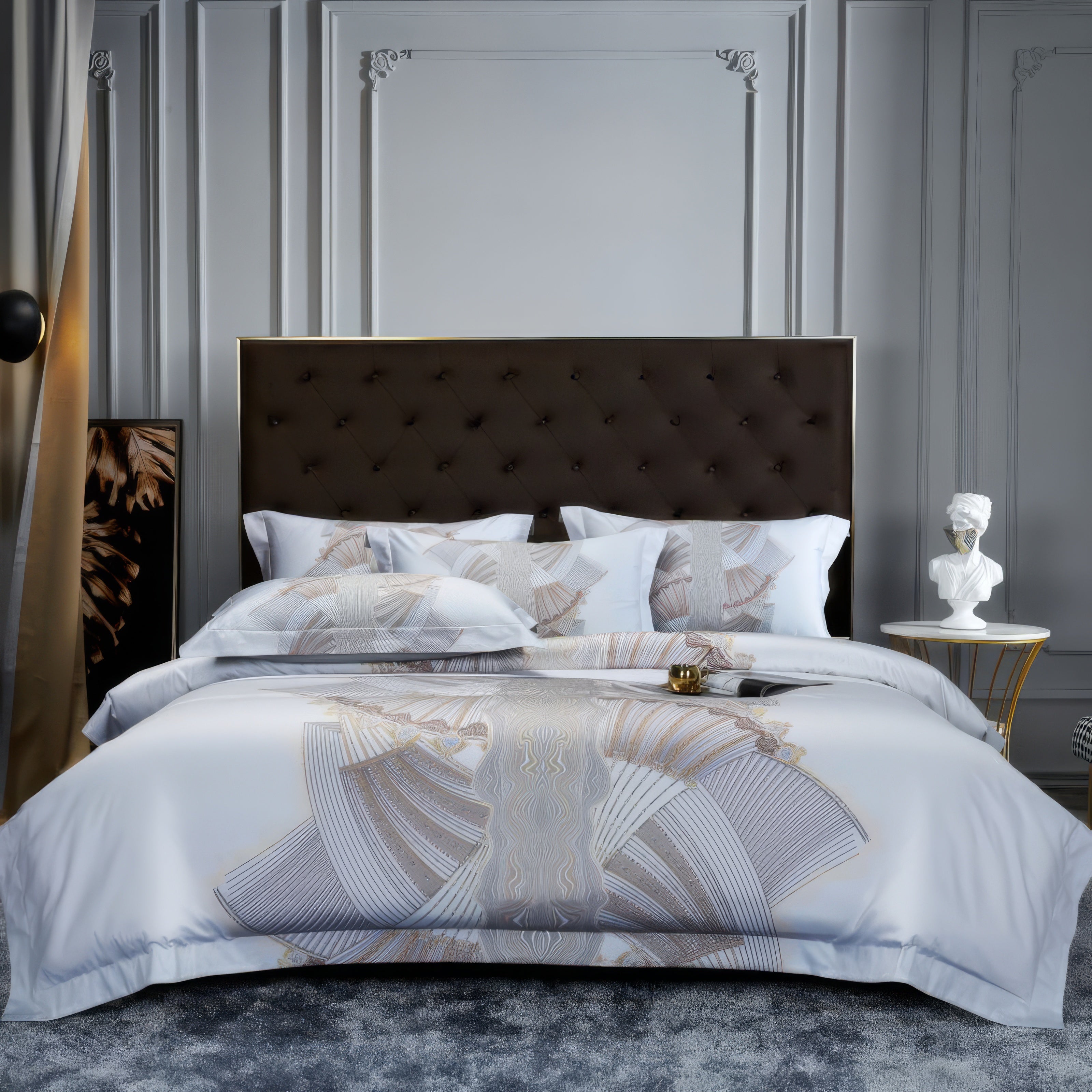 Luxurious white bedding set with a subtle geometric pattern in beige and gray tones, featuring matching pillowcases and a quilted headboard in a sophisticated bedroom setting with classic wall moldings and elegant decor.

