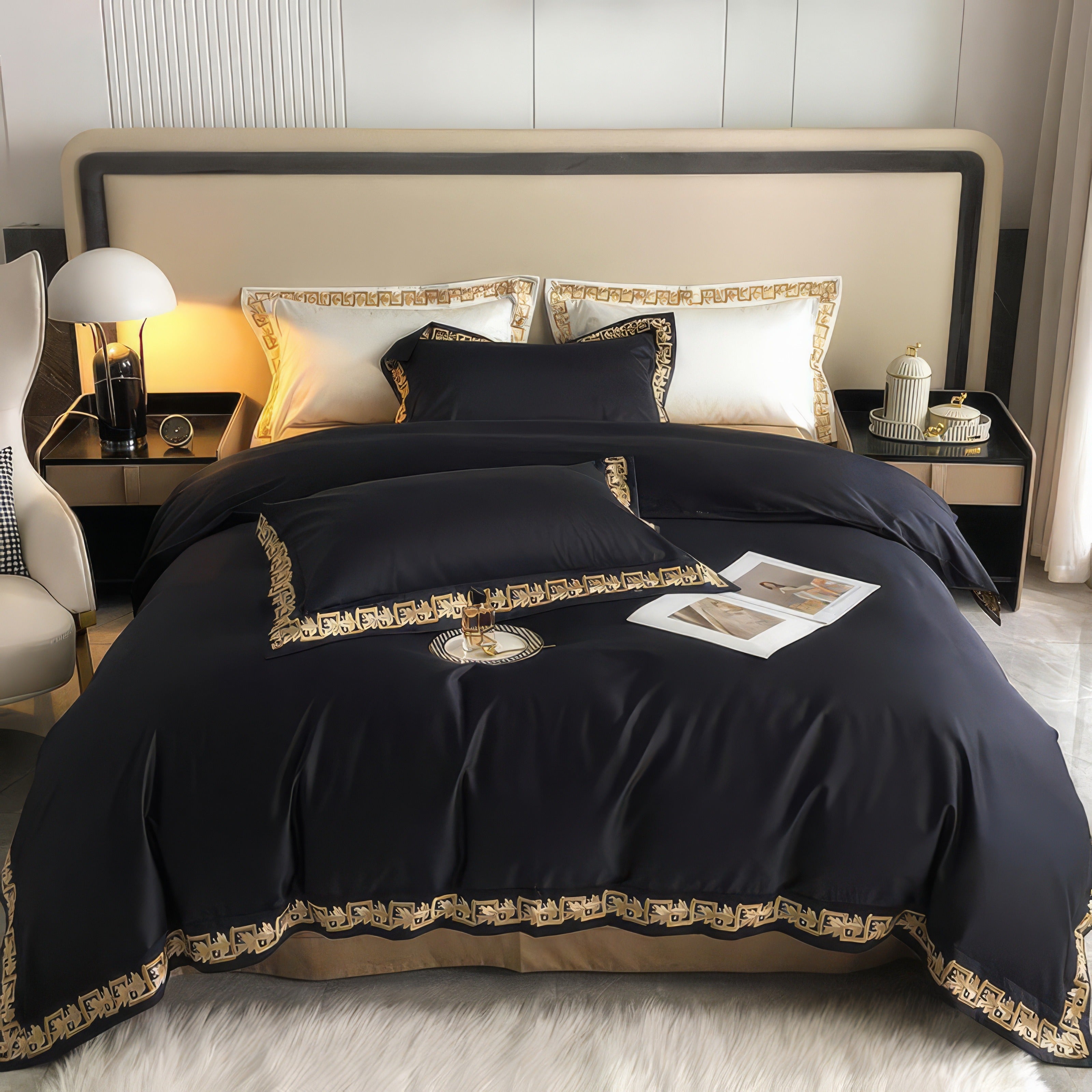 Black bedding set adorned with intricate gold embroidery, paired with contrasting white and gold-trimmed pillows, creating a luxurious and modern bedroom aesthetic.

