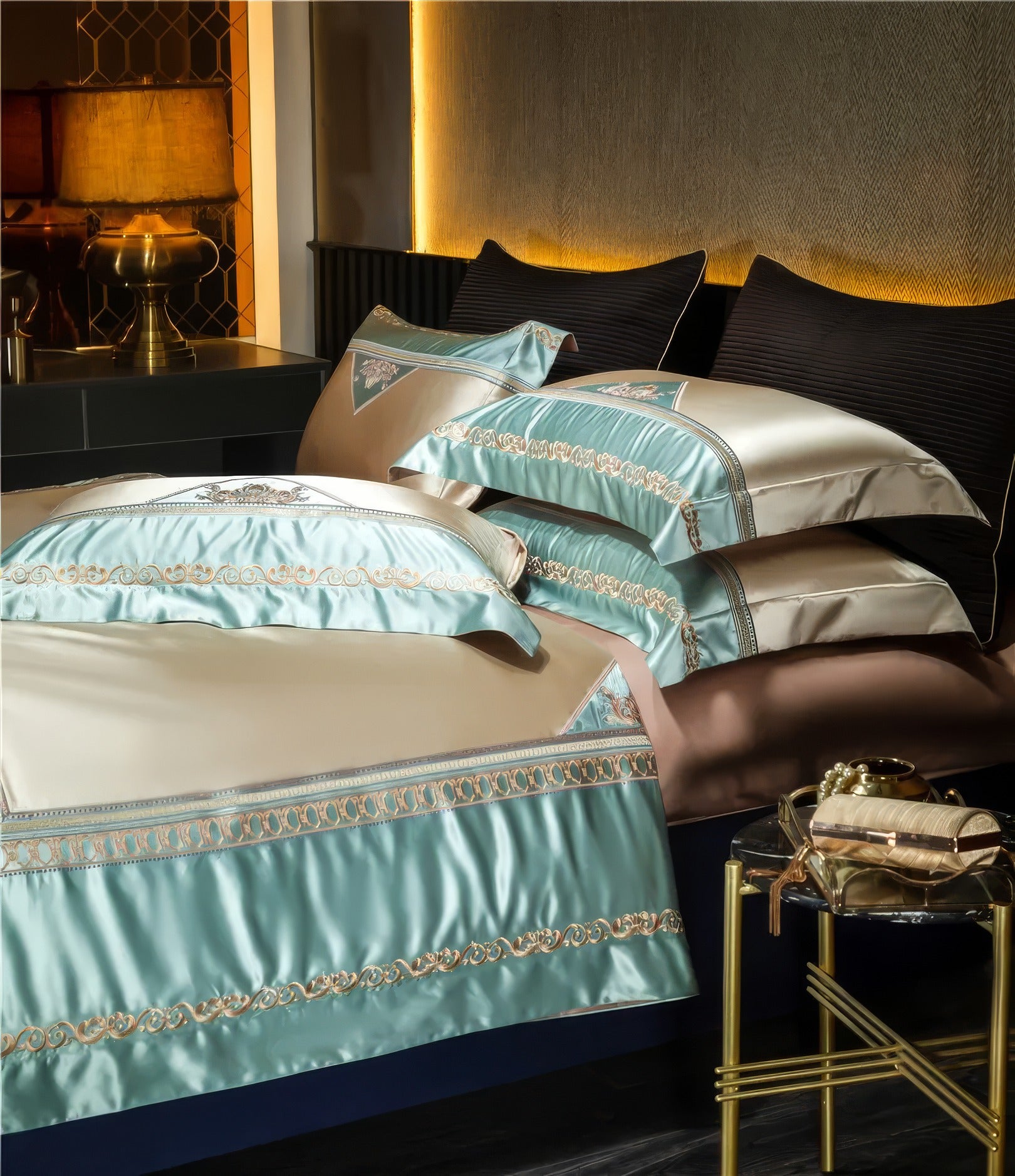 Luxurious satin bedding set in a soft blue and beige color combination, detailed with gold embroidery and decorative patterns, layered with matching pillows, and set in a modern bedroom with ambient lighting and golden accents.

