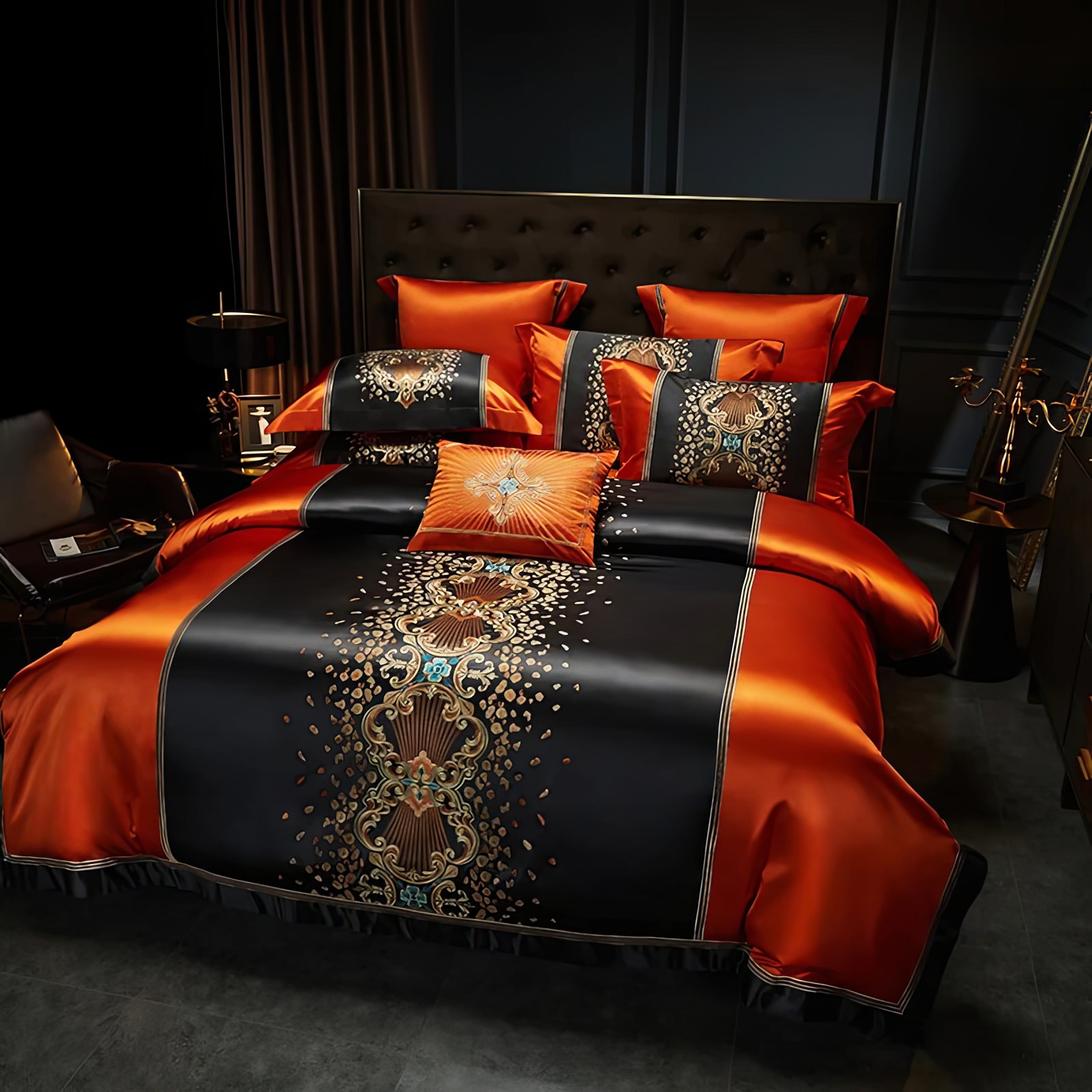 Elegant orange and black bedding set featuring intricate gold and turquoise embroidery, coordinated pillowcases, and a decorative throw pillow, styled in a luxurious bedroom with modern decor and a tufted headboard.