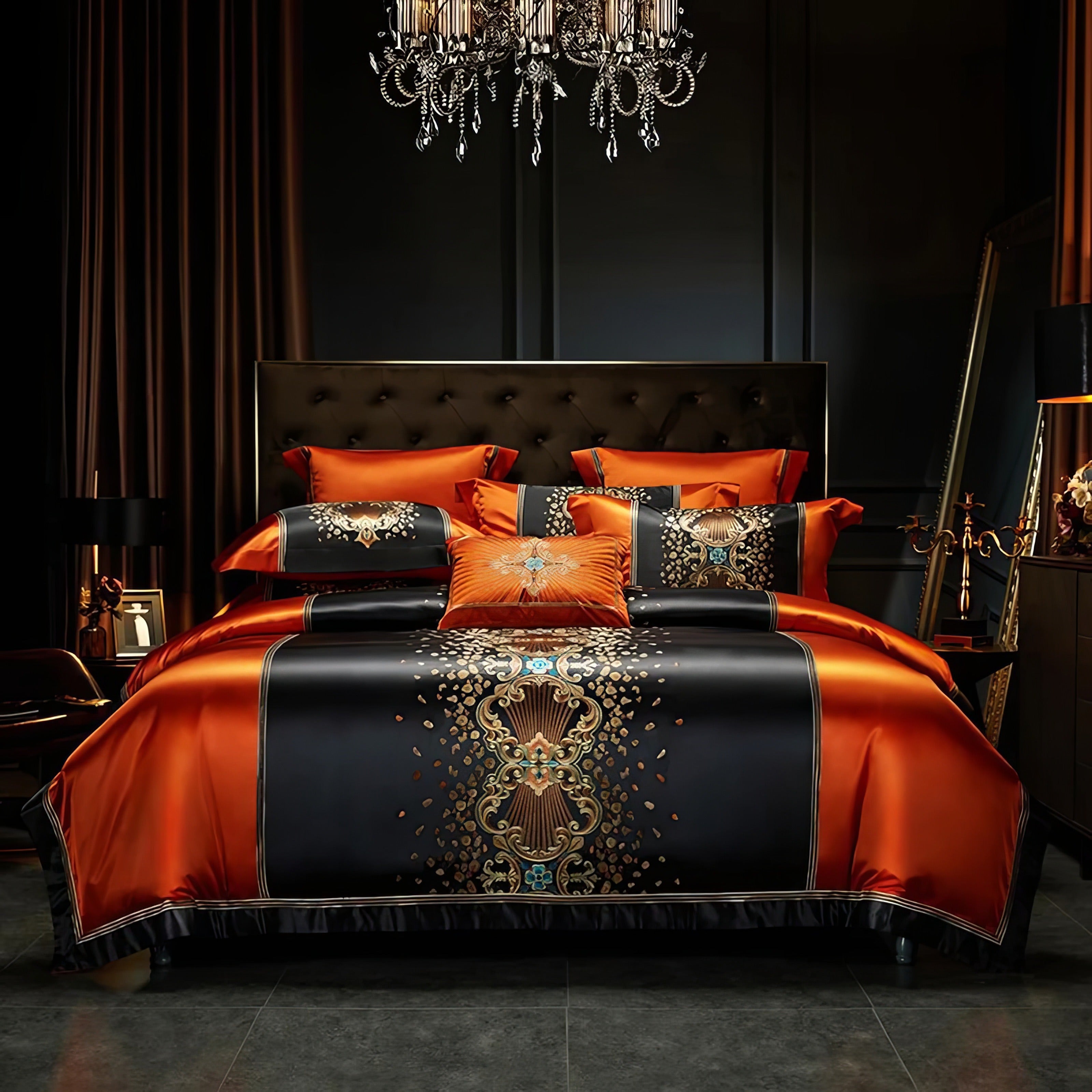 Luxurious orange and black bedding set with ornate gold and turquoise embroidery, featuring matching pillowcases and a decorative throw pillow, styled in an elegant bedroom with a tufted headboard and a grand chandelier centerpiece.